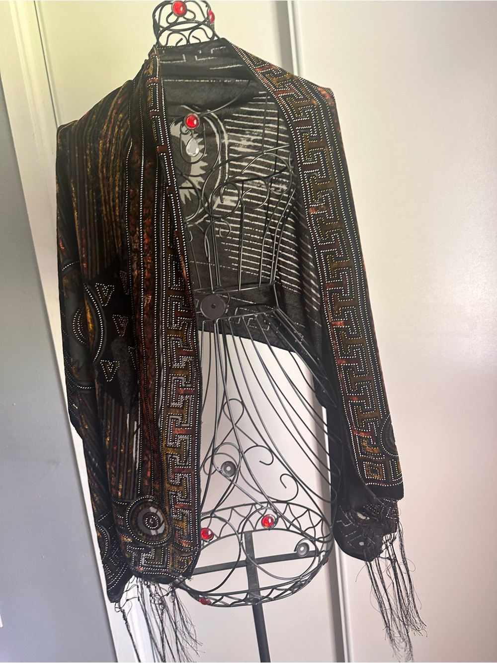 Elegant brown shawl with subtle paisley pattern.